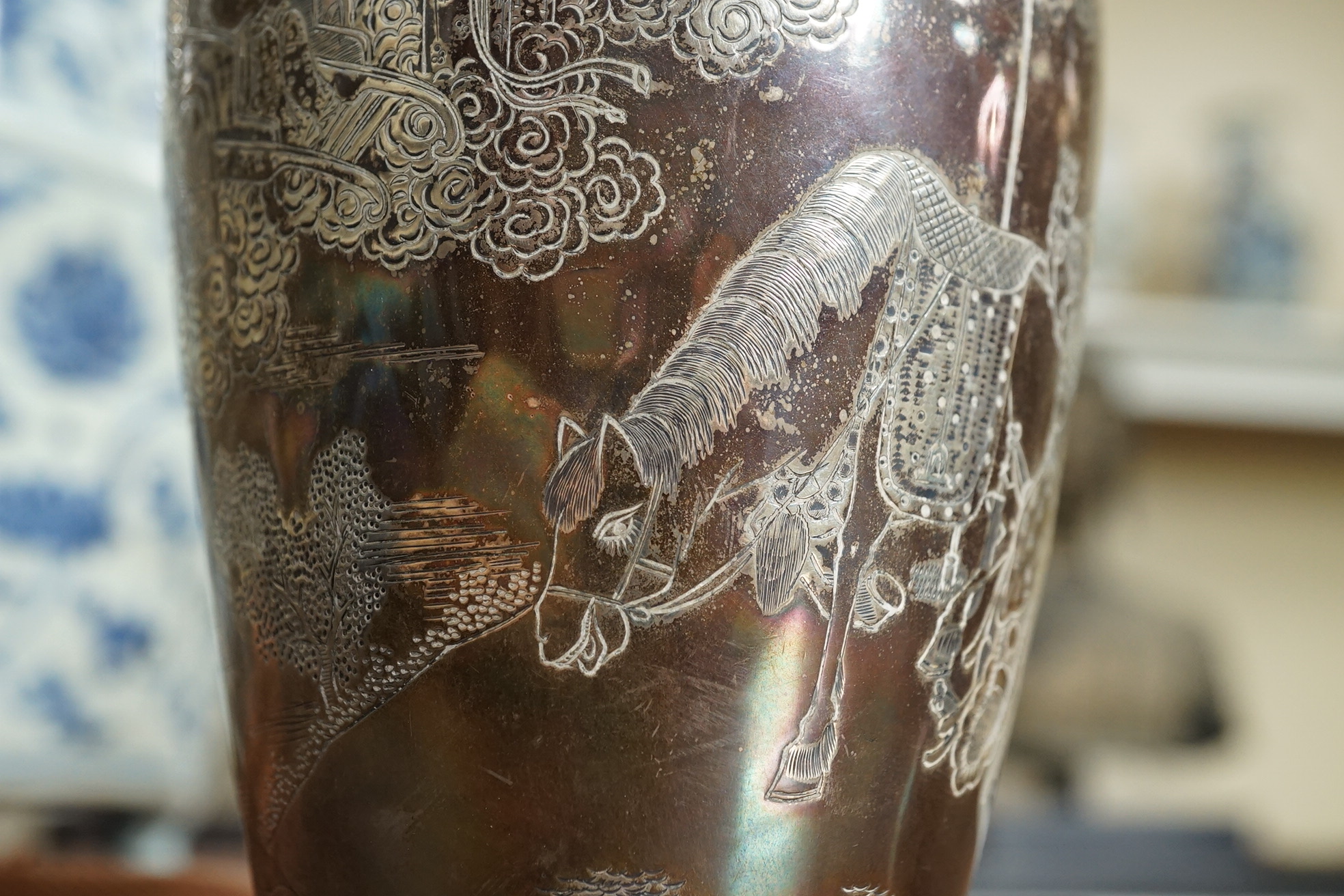 A pair of Chinese silver ‘immortals’ vases, late 19th century